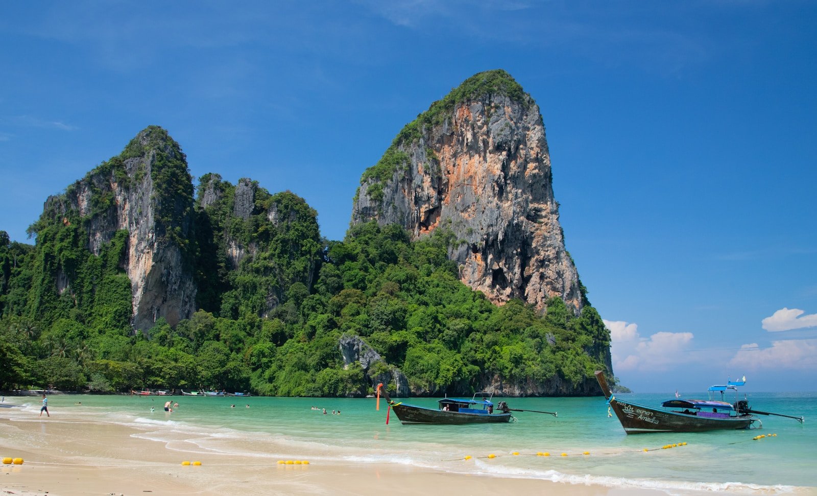Longtail boats on the turquoise water at Railay Beach, Thailand